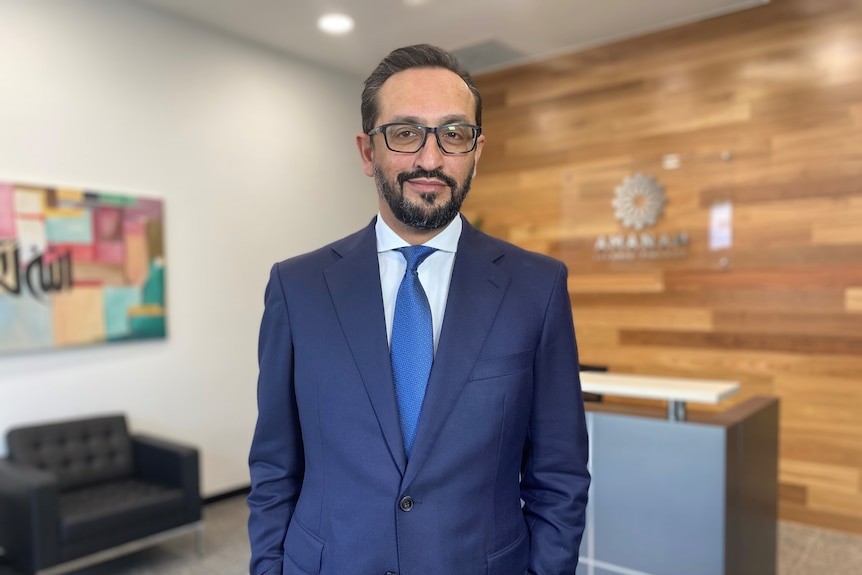 a man in a suit in an office