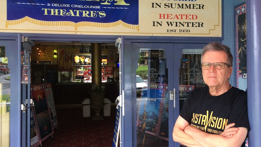 Laurieton's Plaza Theatre owner, David McGowan stands outside the cinema he has lovingly restored.