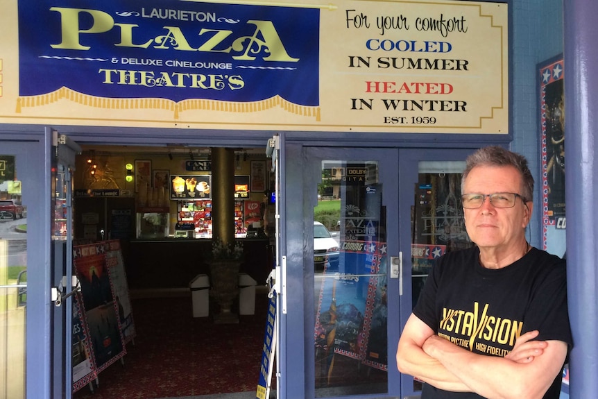 Laurieton's Plaza Theatre owner, David McGowan stands outside the cinema he has lovingly restored.