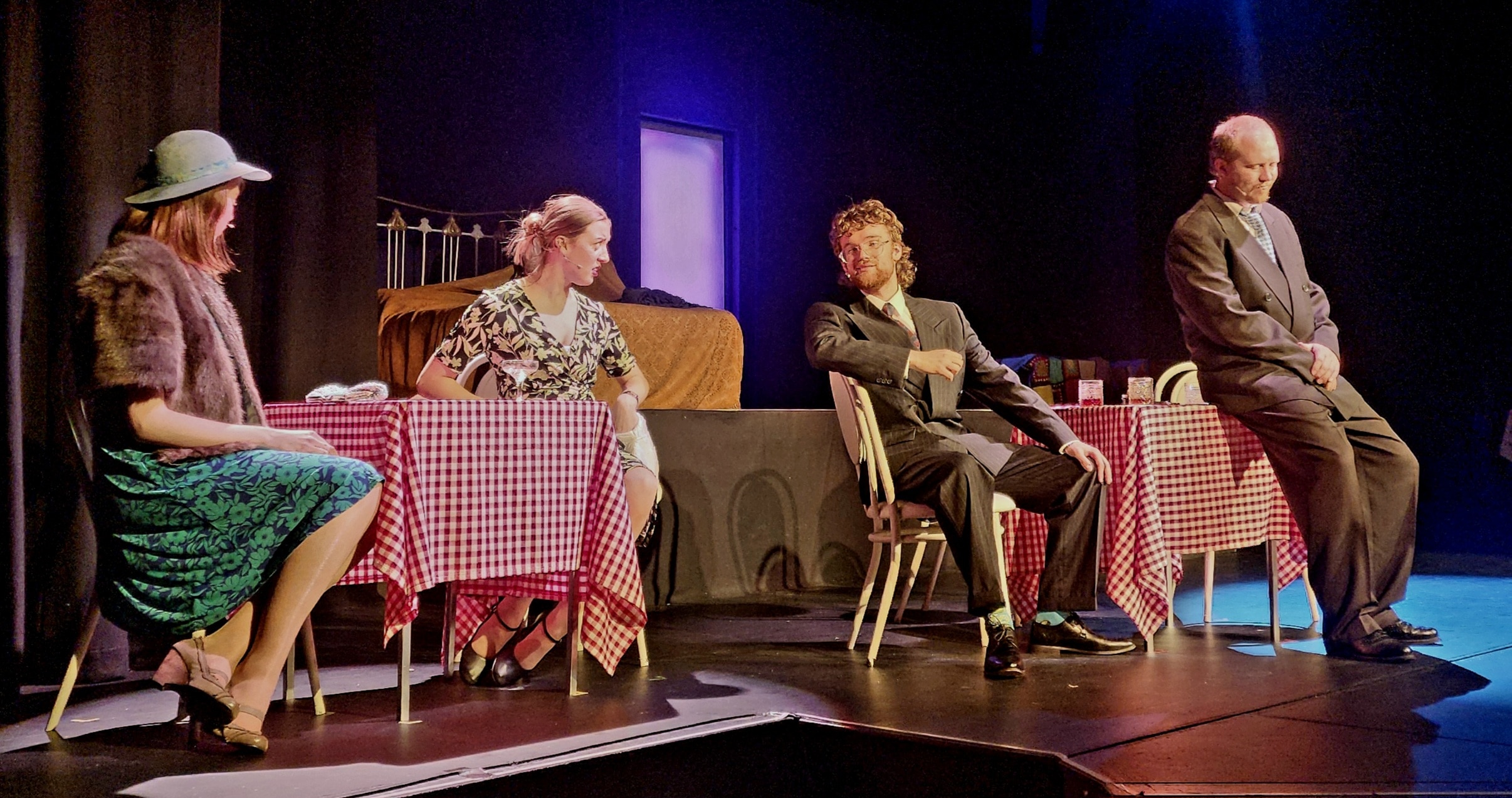 young cast on stage in a cafe scene