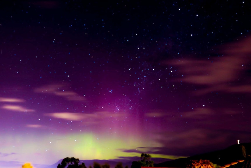 Pink and purple hues seen in this Aurora Australis photo taken at Bridgewater, Tasmania.