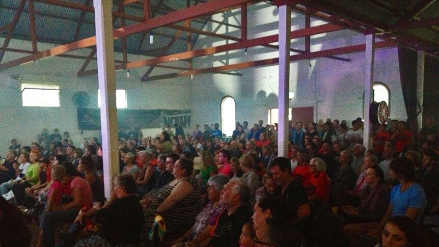 Hundreds of people in the Kempsey Showground hall watching Troy Cassar-Daley and Paul Kelly perform.