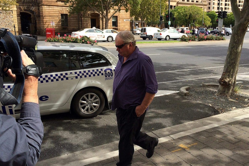Philip John Rollond leaves an Adelaide court.