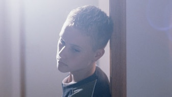 File photo:  Sad teenage boy in doorway (Thinkstock: Comstock)