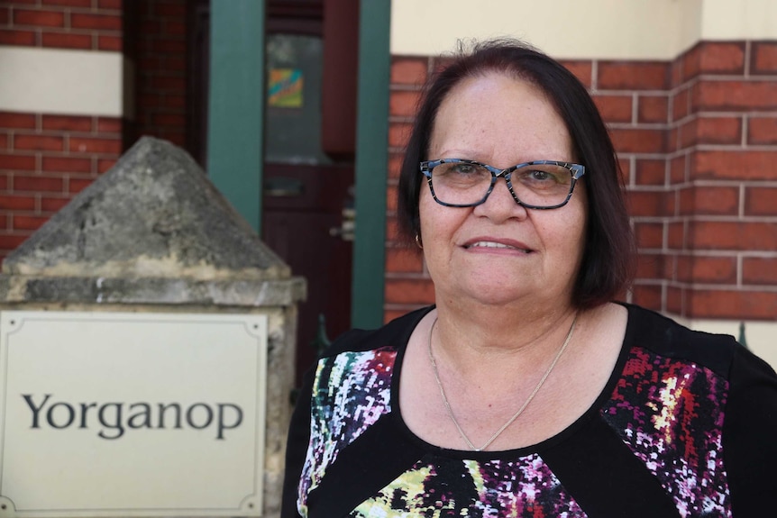 Dawn Wallam standing in front of a building.