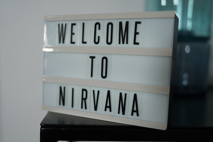 A sign reads Welcome to Nirvana.
