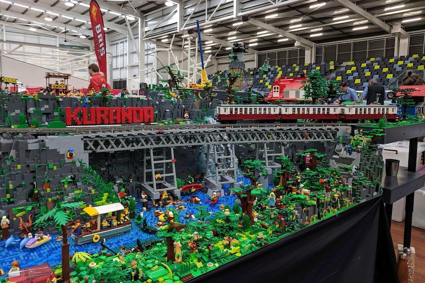 Intricate Lego model of Kuranda Scenic Railway surrounded by rainforest and river.