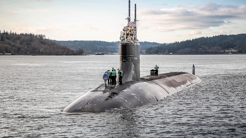 The USS Connecticut is half-visible in the water during sea trials in December 2016.