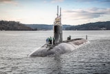 The USS Connecticut is half-visible in the water during sea trials in December 2016.