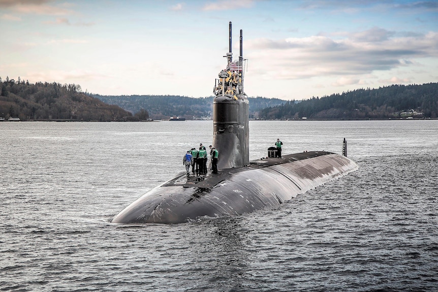 The USS Connecticut is half-visible in the water during sea trials in December 2016.