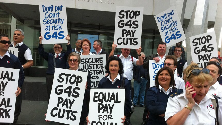 Striking G4S workers outside court