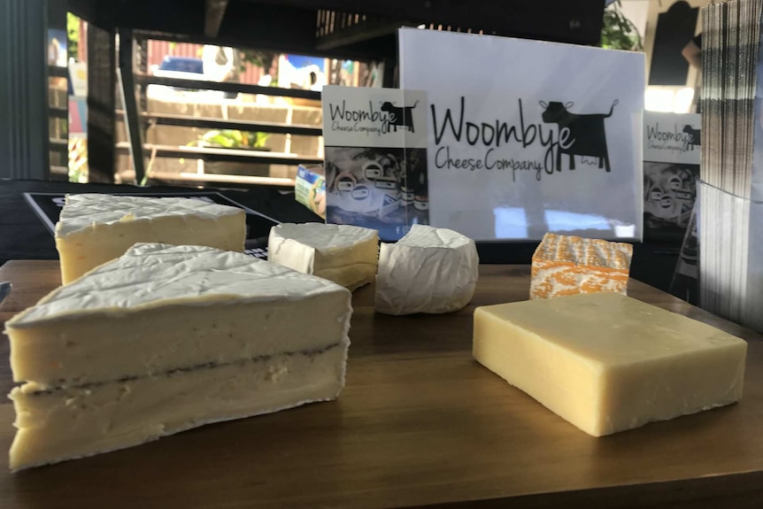 A close-up of a range of different cheeses on a platter.