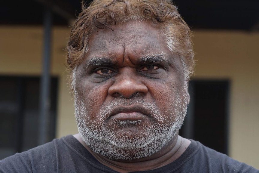 A close-up photo of Indigenous leader Phillip Goodman with a serious expression on his face.