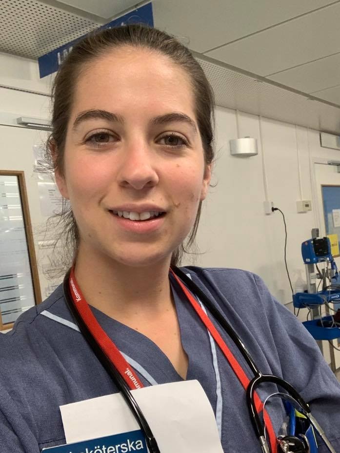 A selfie of Alicia at work in a hospital in Stockholm with a statoscope around her neck.