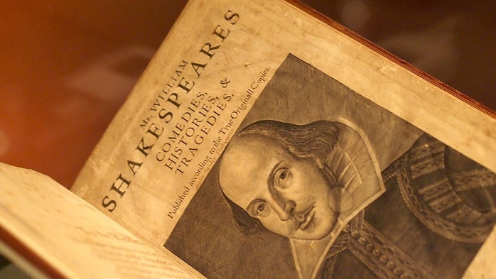 The page of a book features portrait of William Shakespeare