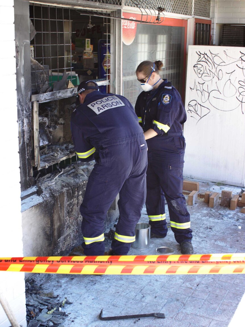 Police investigate the scene after an ATM in High Wycombe, Perth, was set alight.
