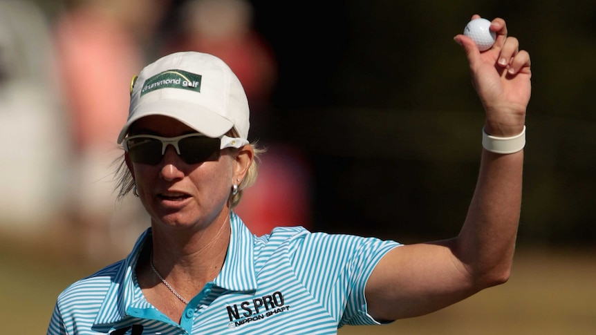 Karrie Webb celebrates after finishing her final round at the Australian Open