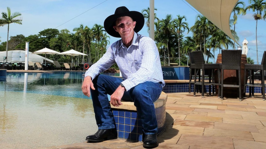 Former bushman-turned-security Billy Lowery sitting beside the pool at Mindil Beach Casino in Darwin