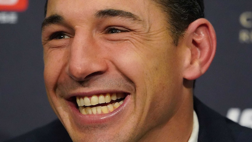 Billy Slater smiles during retirement announcement