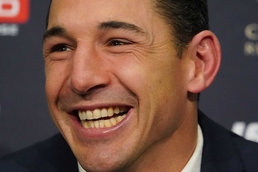 Billy Slater smiles during retirement announcement