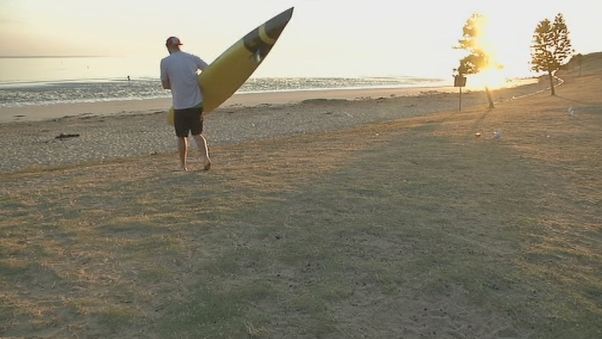 Television still shows a paddleboarder about to attempt to cross the Bass Strait, February 2, 2014.