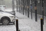 A blanket of hail over a carpark looks like snow
