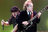 Angus Young (right) is the only original member of AC/DC remaining.