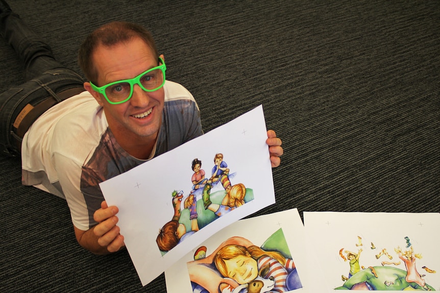 Author Ian McIntosh with illustrations from his book Silly Socks Sleepy Socks