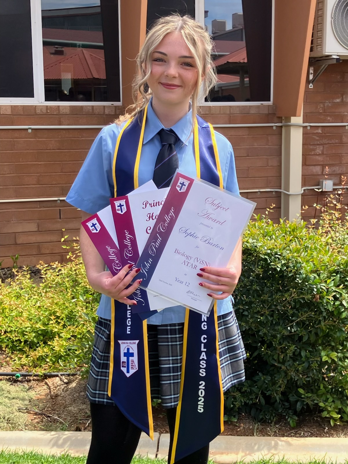 A high school student at her graduation.  