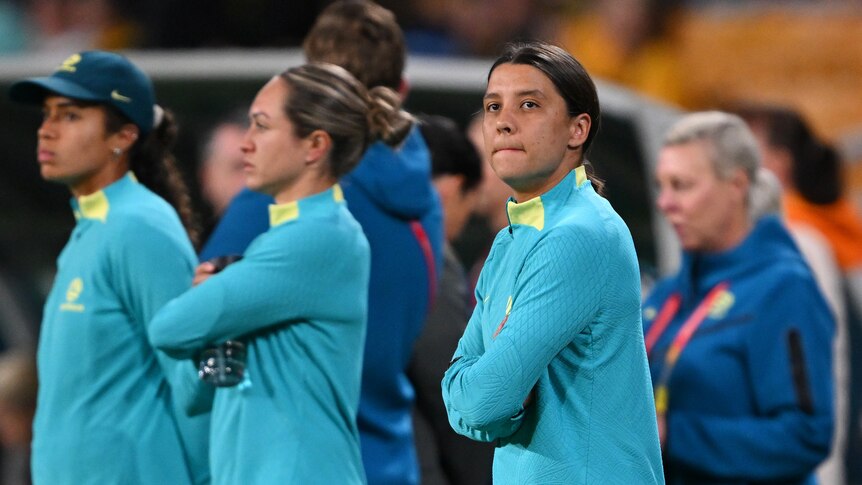 Sam Kerr looks to her left as she watches the Matildas warm up for their World Cup match against Nigeria.