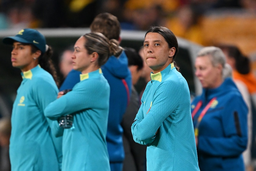 Sam Kerr looks to her left as she watches the Matildas warm up for their World Cup match against Nigeria.