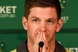 Tim Paine looks on at Cricket Australia review press conference