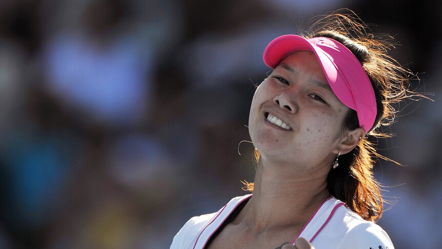 True fight ... Li Na celebrates her win against Petra Kvitova (Paul Miller: AAP Image)