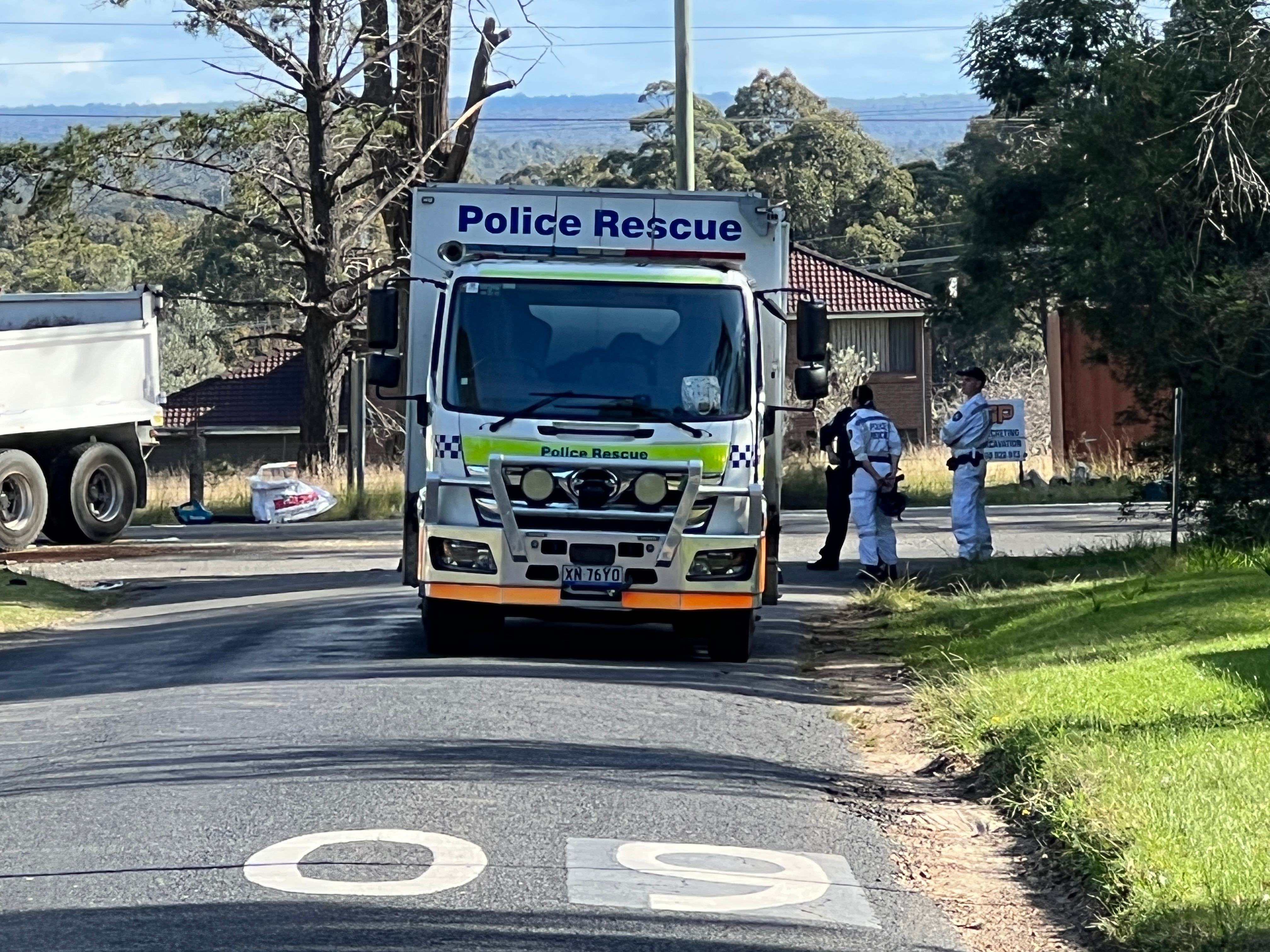 Blue ute and truck crash