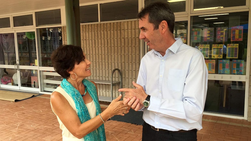 Education Minister Peter Collier in conversation with teacher Liz Beament outside a classroom.