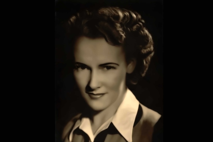 A 1950s sepia-toned portrait of a young woman with wavy hair, gazing into the lens.