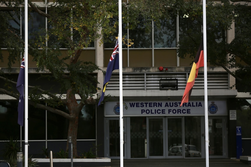 Flags flying at half-mast outside WA Police headquarters.