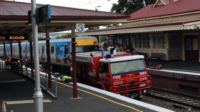 A man died when a train and a car collided at Cheltenham railway station.