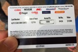 The rear of a Coles gift card with various retail logos and conditions of use.