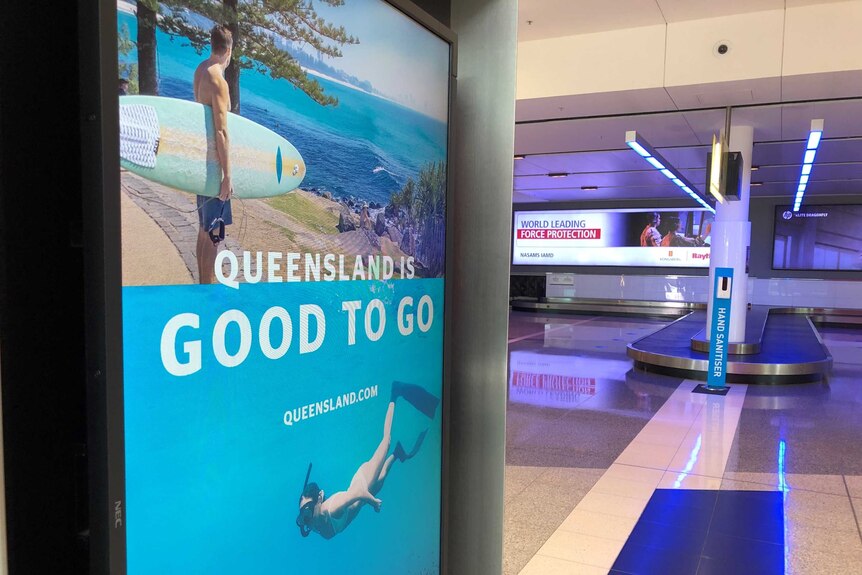 A sign at baggage claim saying "Queensland it good to go".