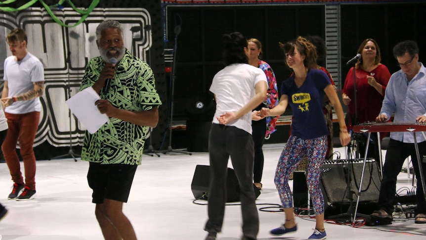 Ernie Dingo with performers