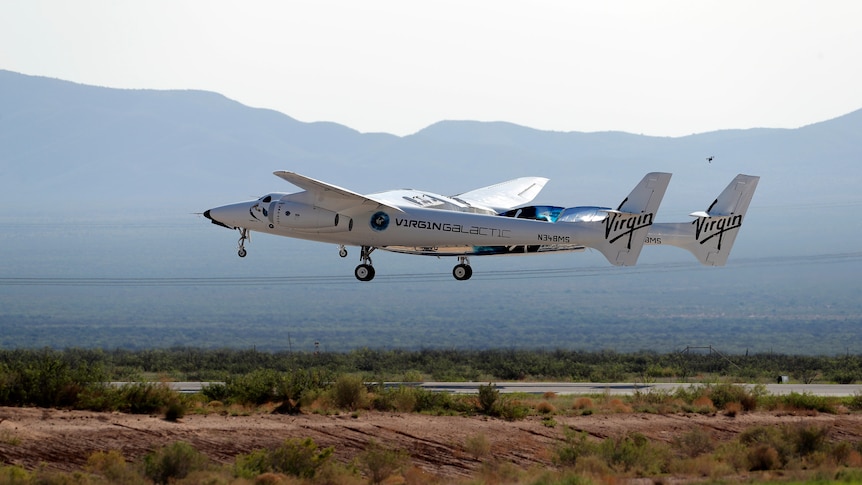 A Virgin Galactic craft takes off in the desert