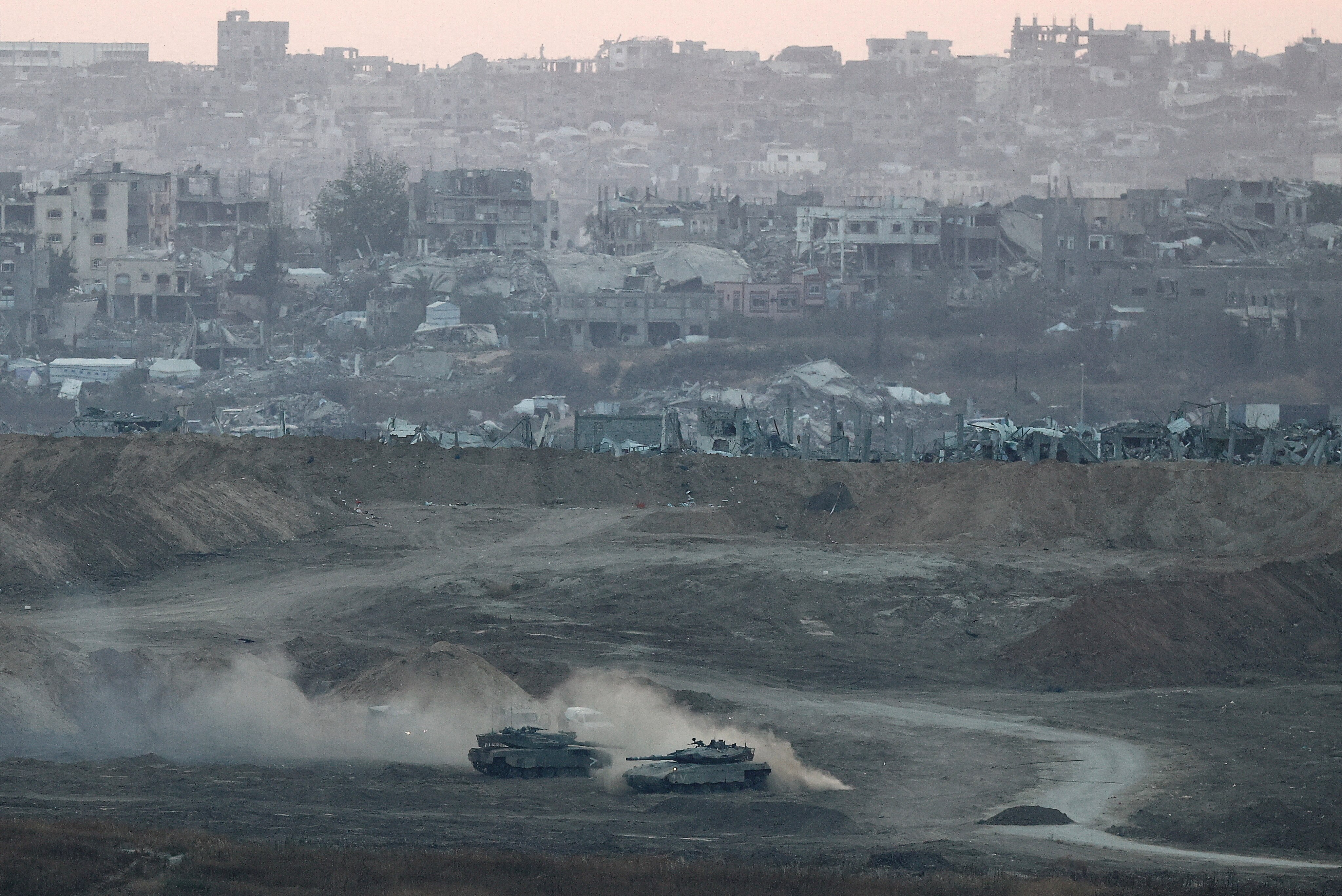Israeli tanks operate in Gaza, as seen from Israel