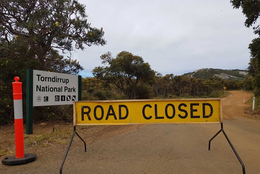 A road closure sign in Torndirrup National Park where the search is being conducted.