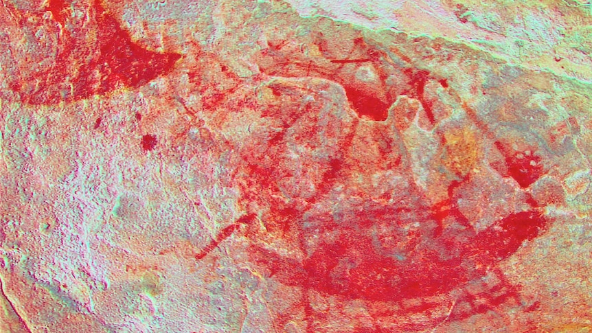 Ochre rock art showing a whale tail and a sailing canoe. Heavily enhanced. Close-up.