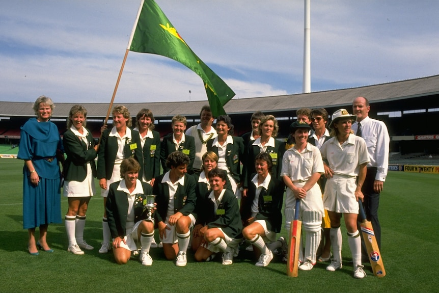 A group photograph of the Australian team with the Trophy.