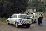Police cars outside the gates of the Mount Lyell copper mine, Tasmania, Jan 17 2014.