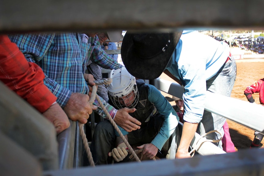 Jared Boghero on a bull in the chutes at the Mount Isa Rodeo