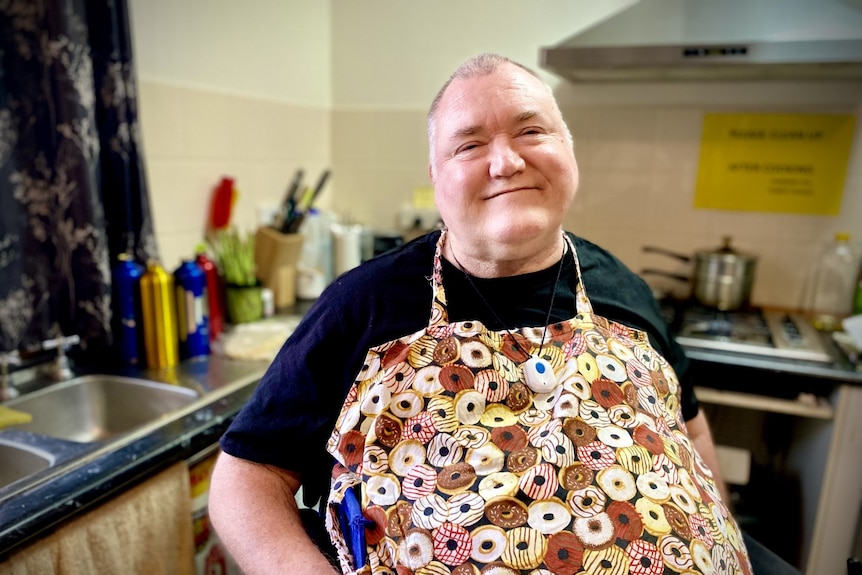 Man in wheelchair sitting in his kitchen