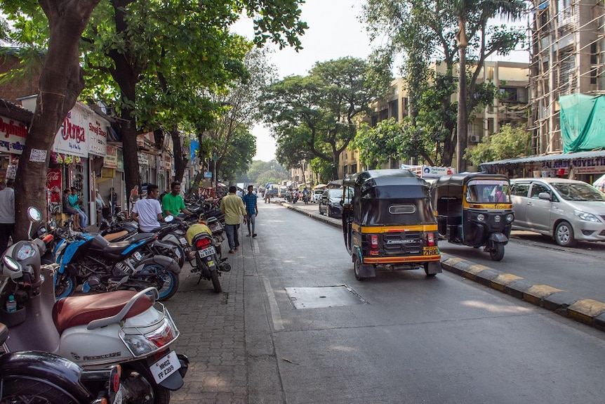 A streetscape with people walking by